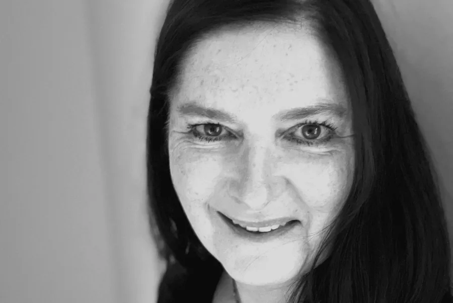 Woman with long hair, smiling