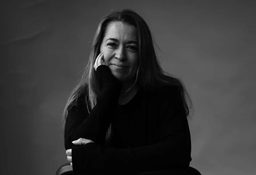 Woman with long hair sitting on chair