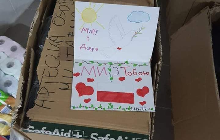 Aid package with a child's hand drawn card