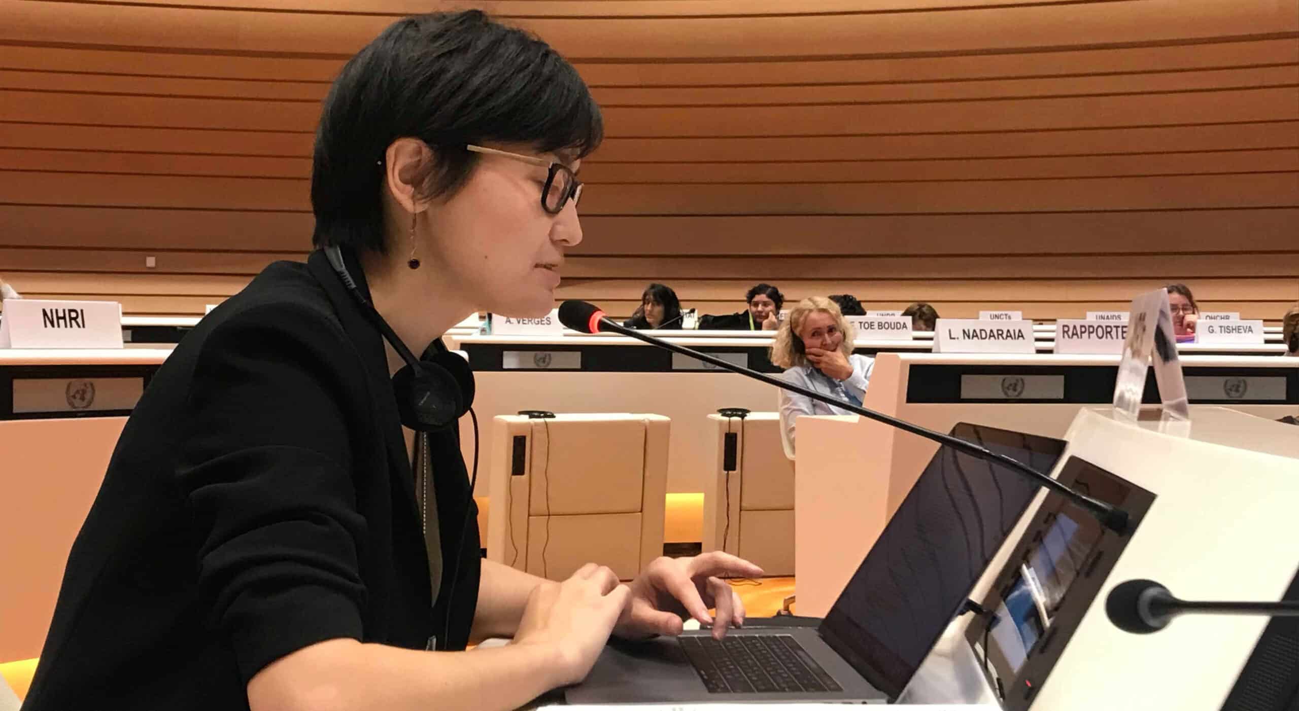 Woman speaking at UN briefing